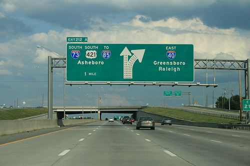 Photo of revised exit signs for I-73 Greensboro Loop on I-40 East. Courtesy of
Evan Semones