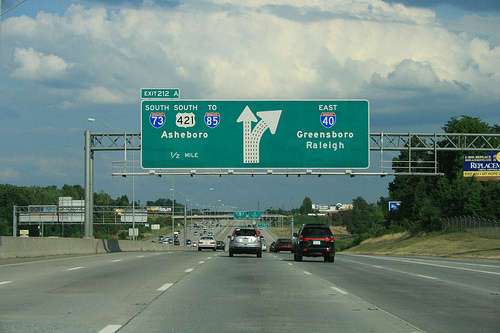 Photo of revised exit signs for I-73 Greensboro Loop on I-40 East. Courtesy of
Evan Semones