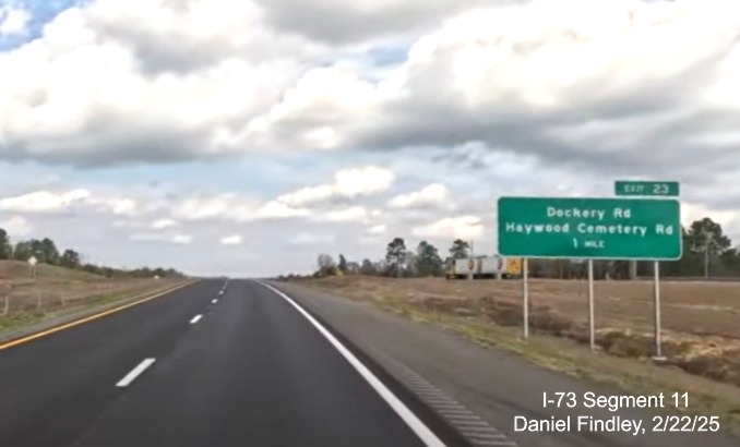 Screen grab image of 1 mile advance sign for the Dockery Road/Haywood Cemetery
Road exit on I-73 North/I-74 West Rockingham Bypass, Daniel Findley, February 2025