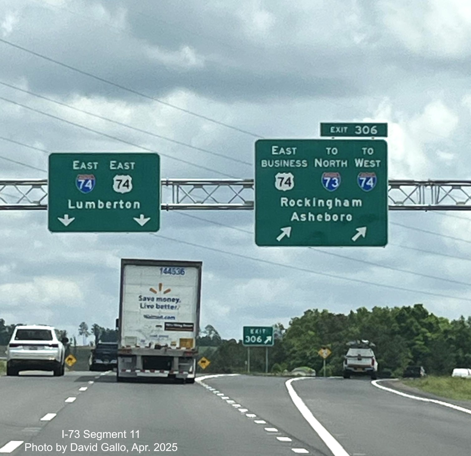 Image of overhead signage on US 74 East at exit for Business 74 and the ramp
to I-73 North/I-74 West Rockingham Bypass by David Gallo, April 2025