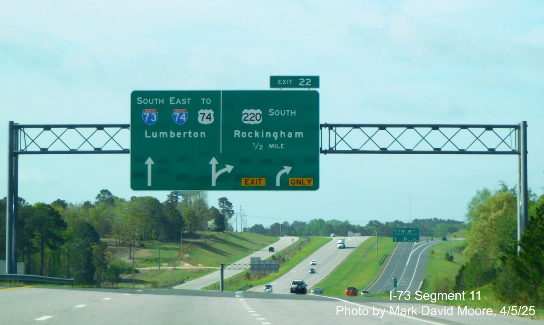 Image of new arrow-per-lane signage for I-73 South/I-74 East approaching US 220 exit heading
south towards the Rockingham Bypass by Mark David Moore, April 2025