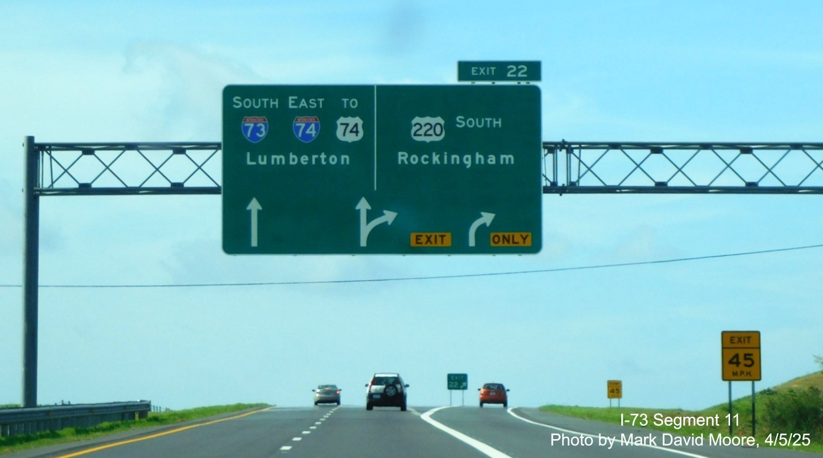 Image of new arrow-per-lane signage for I-73 South/I-74 East at the US 220 exit heading
south onto the Rockingham Bypass by Mark David Moore, April 2025