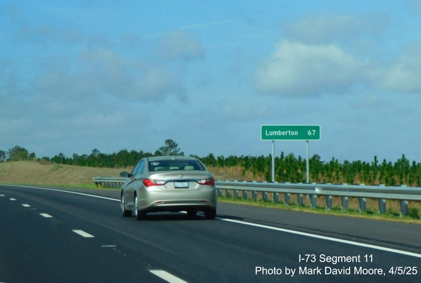Image of ground mounted distance sign for Lumberton prior to the Cartledge Creek
Road exit on I-73 South/I-74 East Rockingham Bypass by Mark David Moore, April 2025