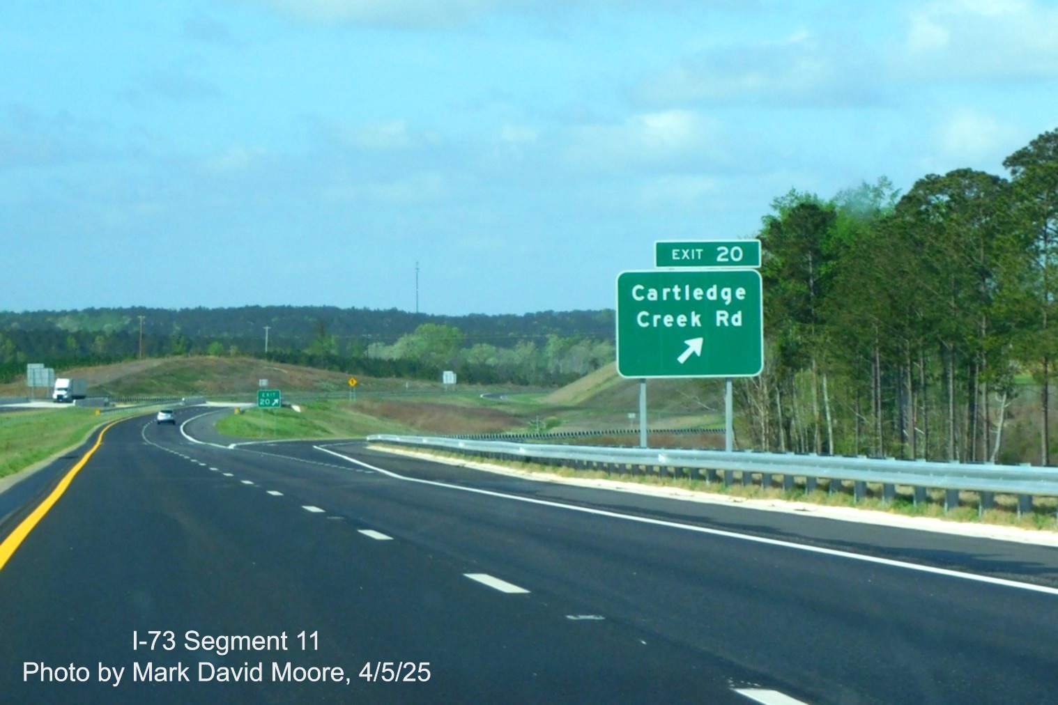 Image of ground mounted ramp sign for Cartledge Creek Road exit on I-73 South/
I-74 East Rockingham Bypass by Mark David Moore, April 2025