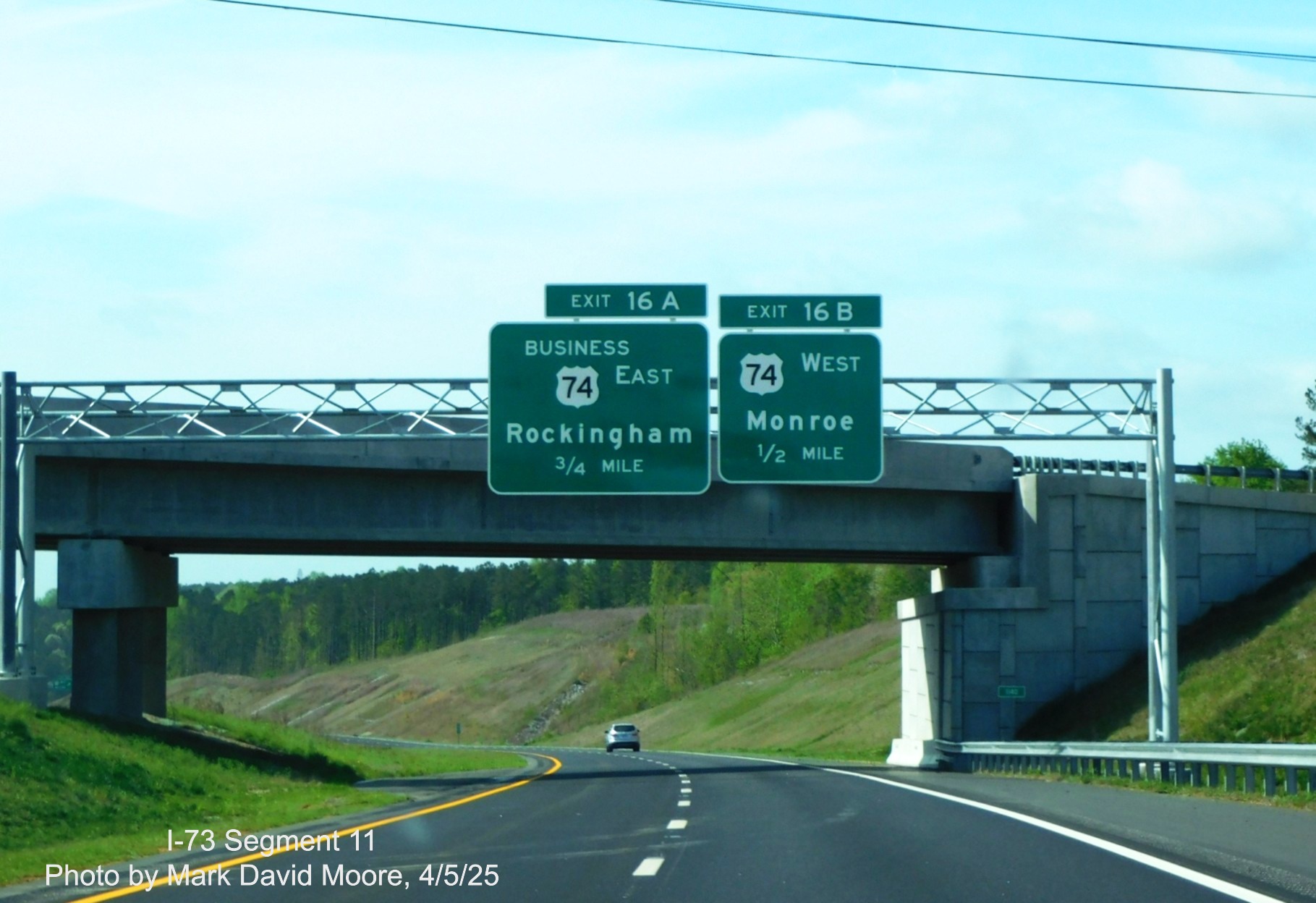Image of 3/4 and 1/2 mile advance signs for Business 74 and West US 74 exits on
I-73 South/I-74 East Rockingham Bypass by Mark David Moore, April 2025