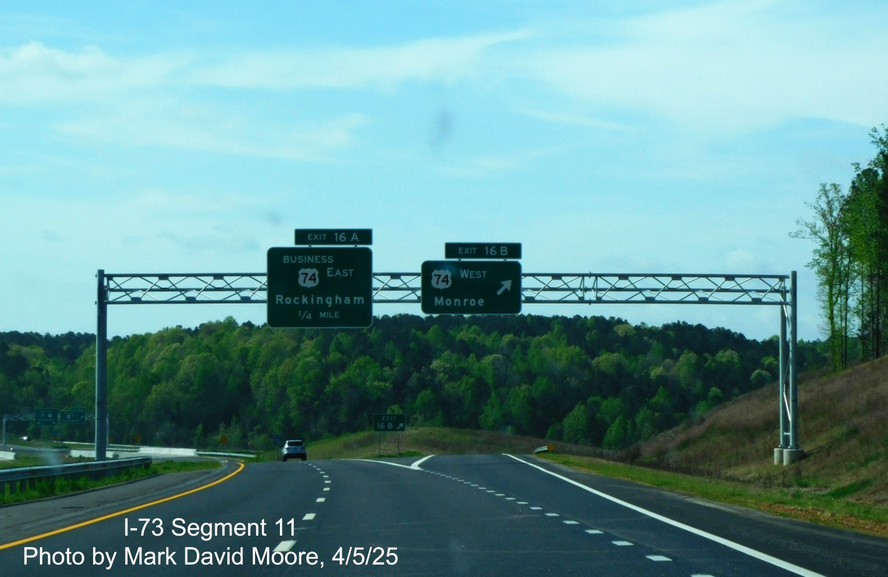 Image of 1/4 advance and ramp signs for Business 74 and West US 74 exits on
I-73 South/I-74 East Rockingham Bypass by Mark David Moore, April 2025