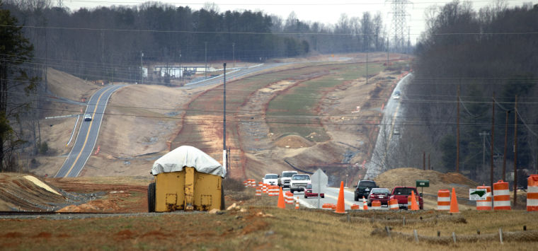 Image of US 220 widening construction progress for I-73, Lyn 
Hay Greensboro News Record, 2/1/14