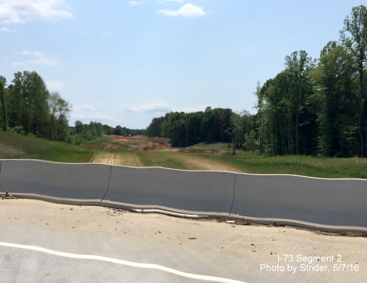 Image of future I-73 lanes graded under US 220 South off-ramp bridge, by Strider