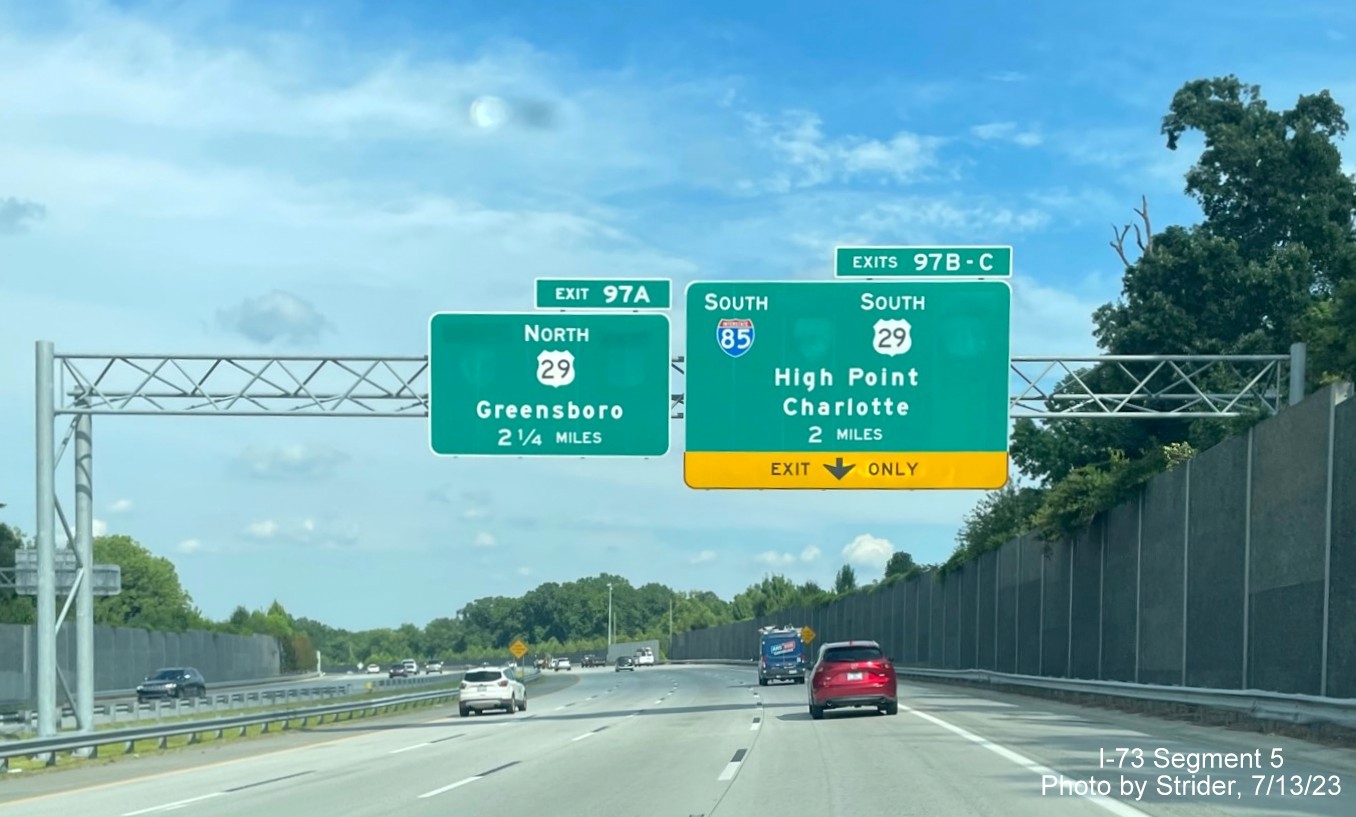Image of removed Business 85 and US 70 shields from advance signage approaching the I-85/US 29 interchange 
        on I-73/US 421 South, photo by Strider, July 2023