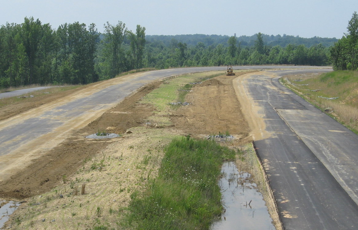 Photo of view looking south along I-74 freeway showing curve in route under 
construction, June 2009