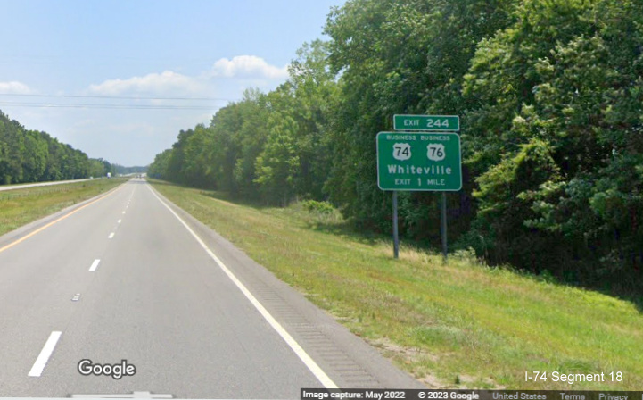 Image of ground mounted 1 mile advance sign for Business US 74/76 exit on US 74/76 (Future I-74) East in Whiteville,  Google Maps Street View, May 2022