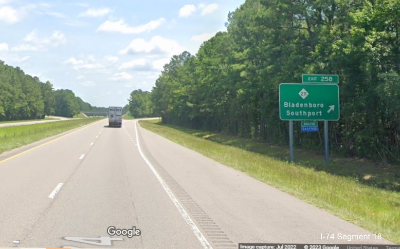 Image of ground mounted 1/2 mile advance sign for NC 211 exit on US 74/76 (Future I-74) East 
            in Supply, Google Maps Street View image, July 2022