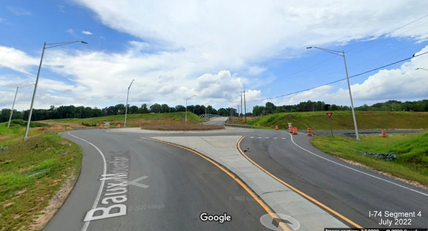 Image of new roundabout along Baux Mountain Road south of unopened Winston-Salem Northern 
          Beltway with future ramps to and from NC 74 (Future I-74) East, Google Maps Street View, July 2022