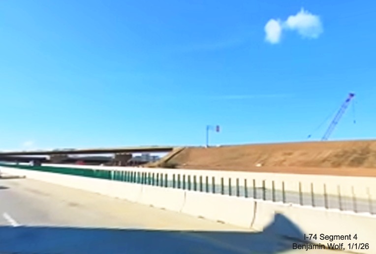 Image of overhead sign installed on flyover ramp as seen from I-40 East in the
Winston-Salem Northern Beltway interchange project work zone, screen grab from Benjamin Wolf video, January 2026