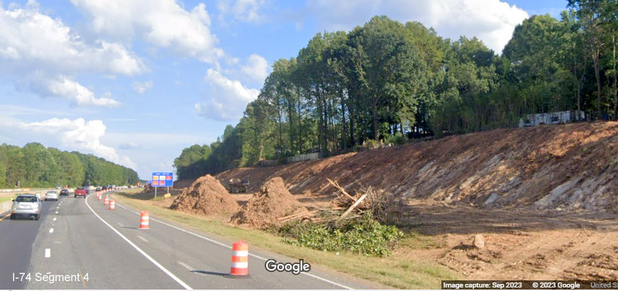 View of recent excavation along I-74 East lanes in Winston-Salem Northern Beltway 
       interchange work zone, Google Maps Street View, September 2023