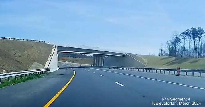 Image of closer view of NC 74 (Future I-74) East heading under US 52 North, 
       screen grab from TJElevatorfan video, March 2024