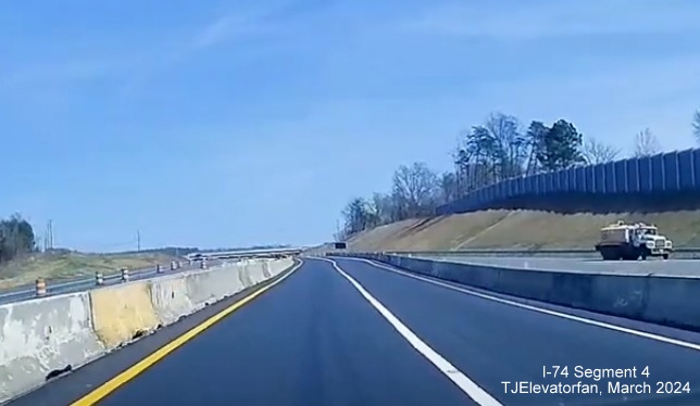Image of current NC 74 (Future I-74) East/Winston-Salem Northern Beltway moving to their
       permanent alignment after the Grassy Creek bridge, screen grab from TJElevatorfan video, March 2024