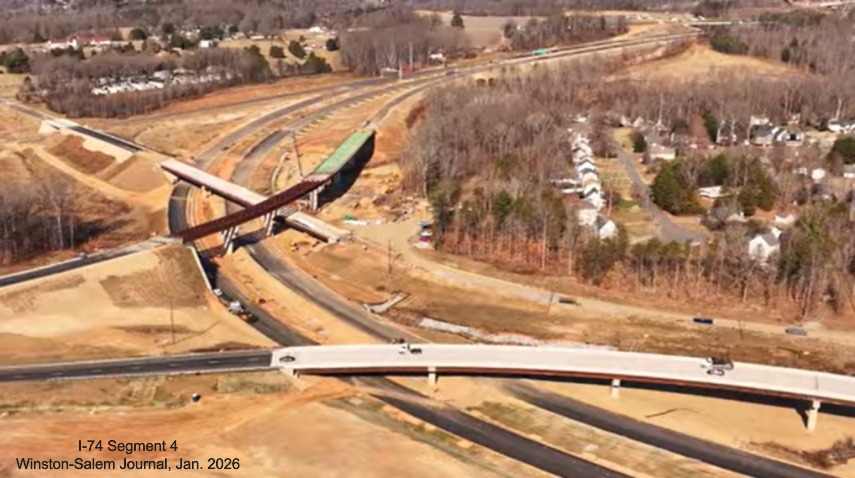 Image over Beltway flyover ramps under construction at I-74 as part of the Winston-
Salem Northern Beltway interchange project, screen grab from Winston-Salem Journal video, January 2026