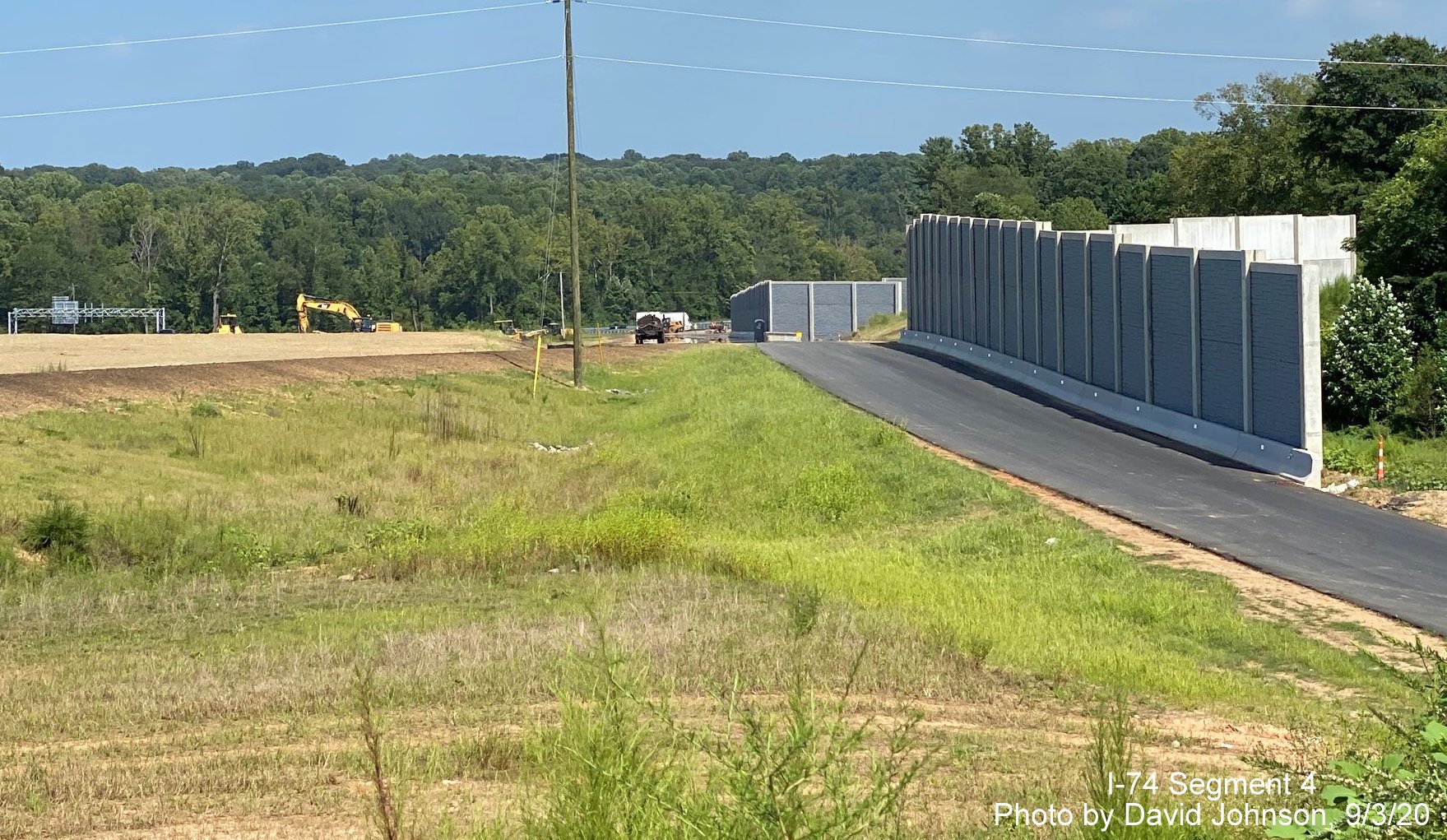 Image of noise wall along soon to open ramp from US 421/Salem Parkway to 
      NC 74 West Winston-Salem Northern Beltway, by David Johnson September 2020