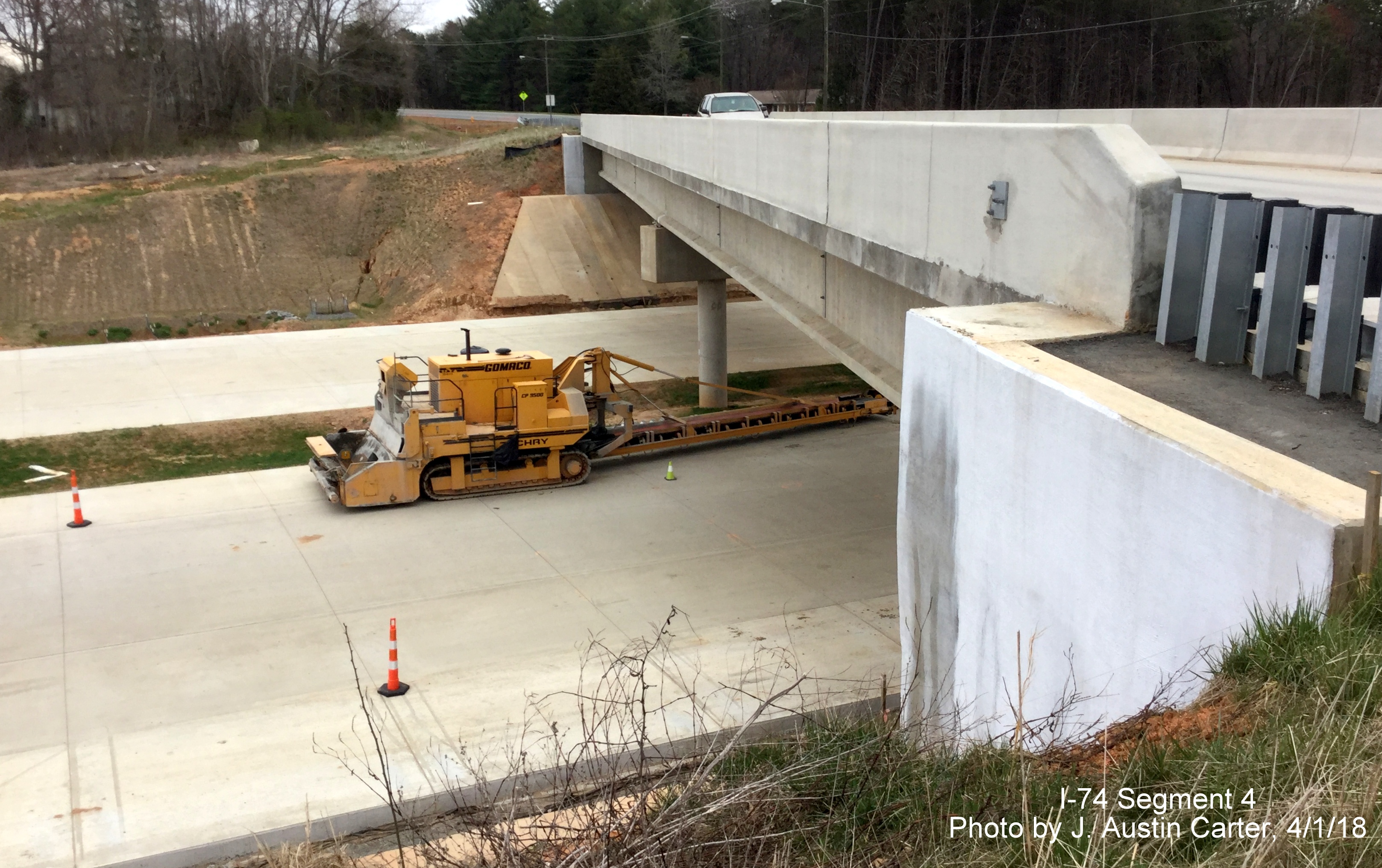 Image of nearly completed Winston-Salem Beltway roadbed from completed bridge carrrying Walkertown-Guthrie Rd over the Beltway, by J. Austin Carter
