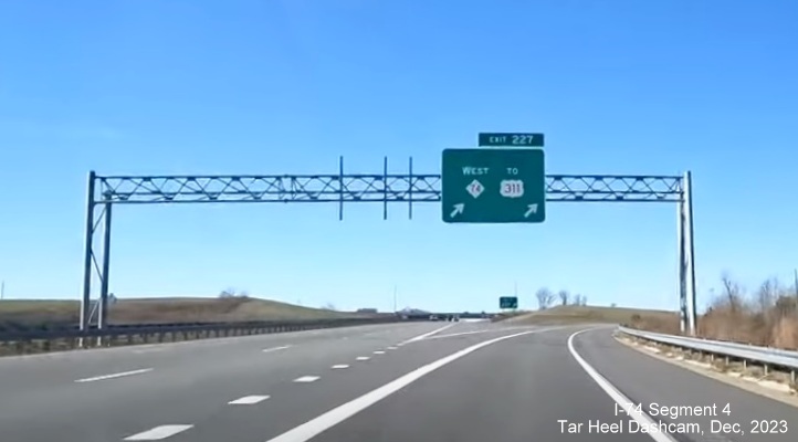 Image of unchanged signage along US 421 North/Salem Parkway for the NC 74/Winston-Salem Northern
        Beltway exit after segment from NC 66 to US 52 South opened in late November, from video by Tar Heel Dashcam, December 2023