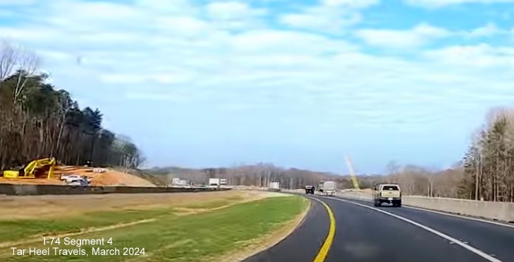 Image of I-74 West in new lanes in Winston-Salem Northern Beltway interchange construction area, from 
        video by TarHeel Travels, March 2024