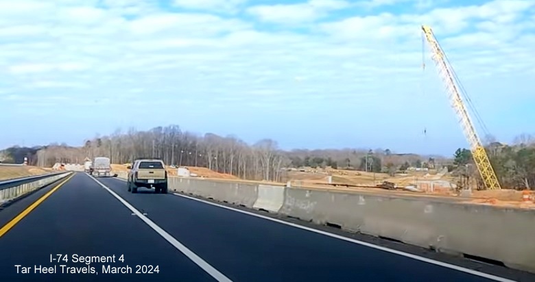 Image of future Winston-Salem Northern Beltway lanes in interchange construction area, from 
        video by TarHeel Travels, March 2024