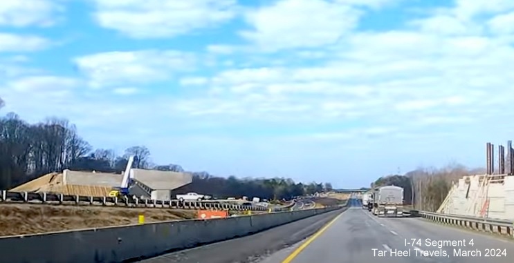 Image of ramp structures being built for Winston-Salem Northern Beltway interchange in I-74 median, from 
        video by TarHeel Travels, March 2024