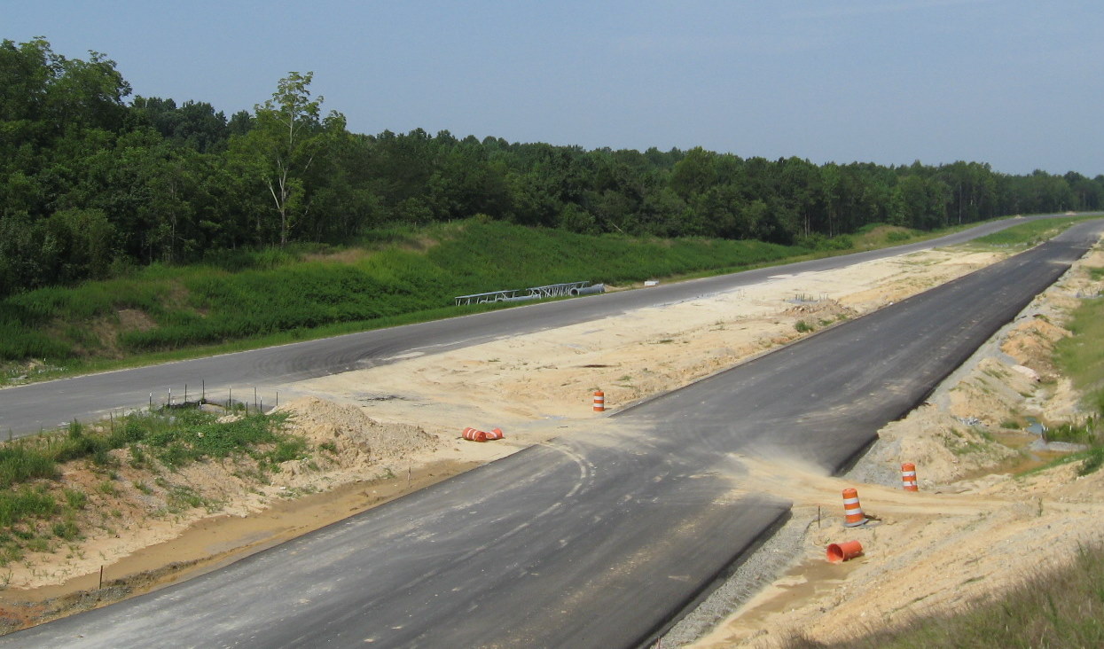 Photo of collection of future sign poles for the US 311/NC 62 exit in July 
of 2010