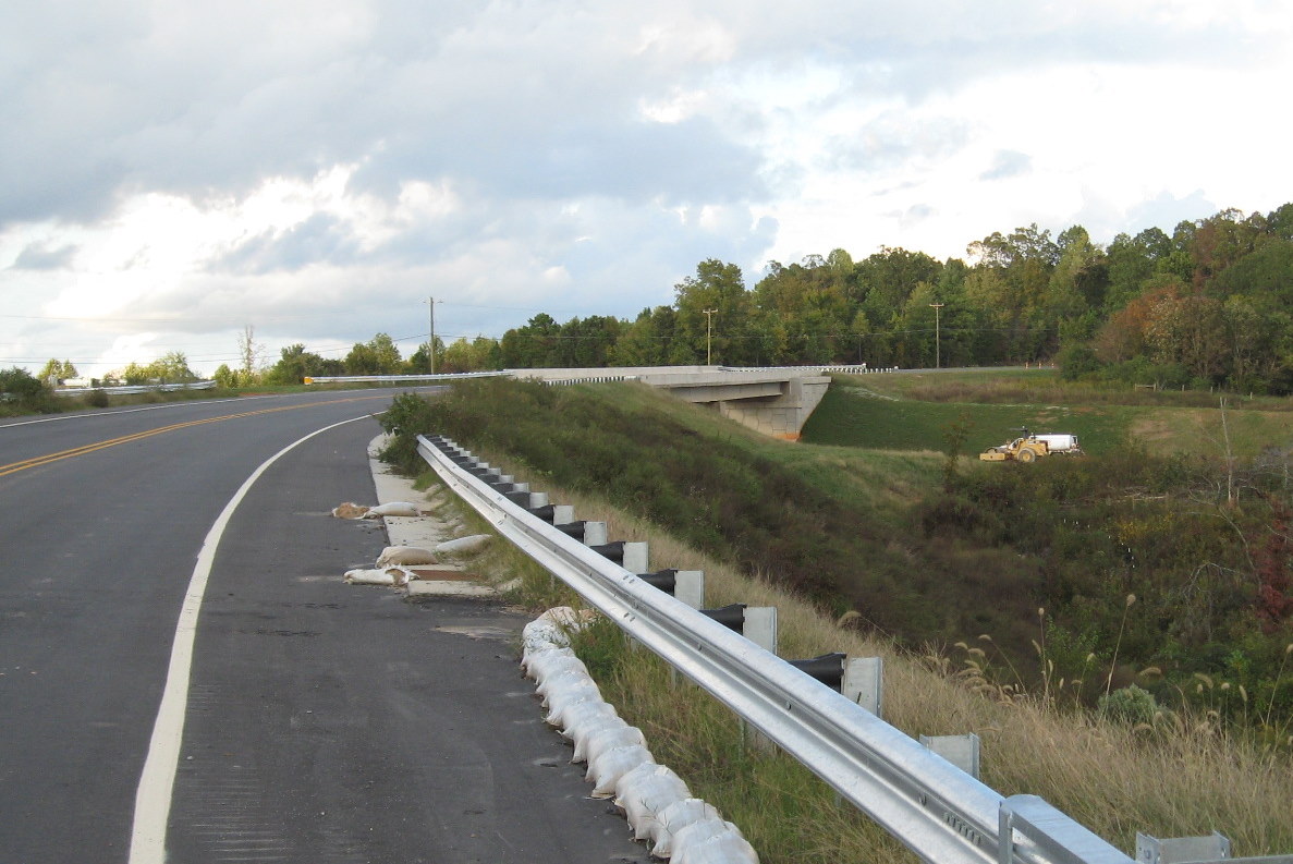 Photo approaching Heath Dairy Road bridge from the west showing roadbed 
still under construction over future I-74 freeway near Randleman in Oct. 2011