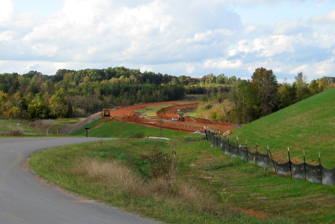 Photo of view north of Plainfield Rd Bridge showing progress in grading the 
future I-74 freeway roadbed in Oct. 2011