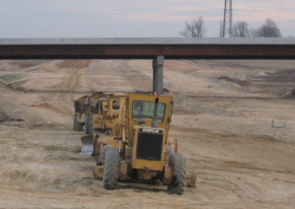 Photo showing progress in grading the future freeway roadbed in vicinity of the 
Cedar Square Rd interchange in Jan. 2010
