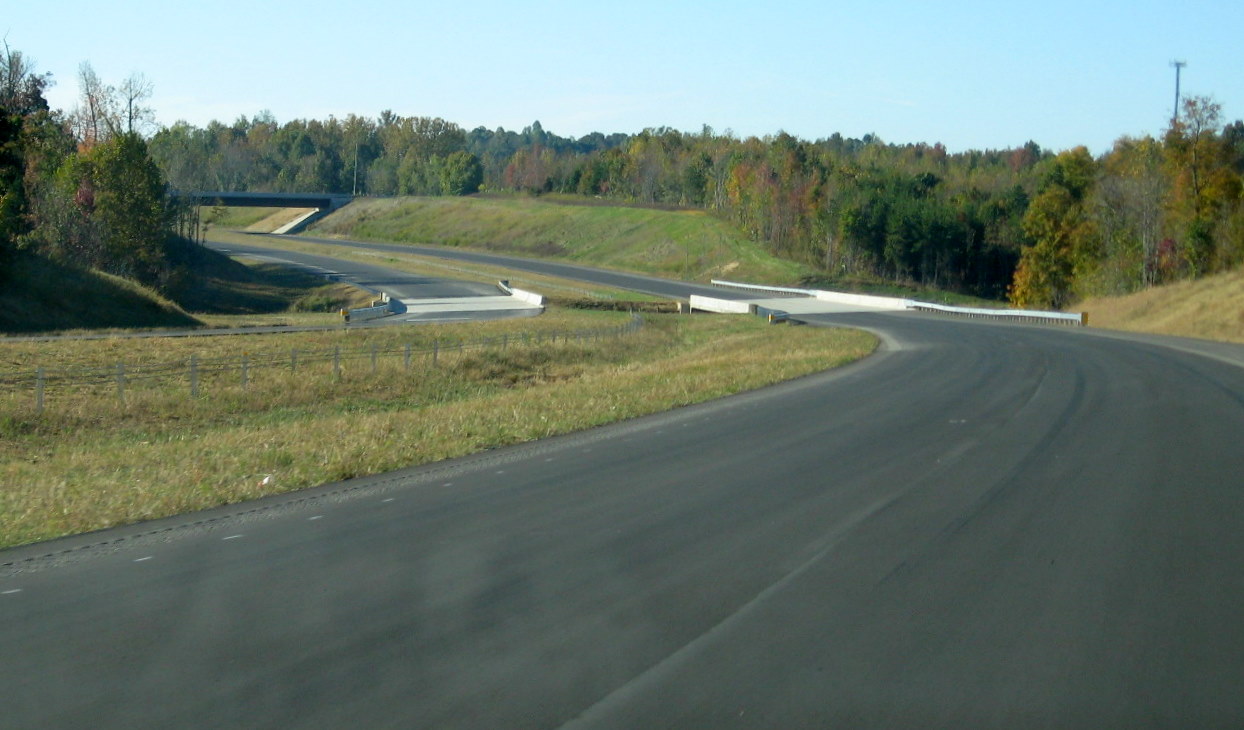Photo of view along unopened I-74 East freeway approaching the Poole Rd 
Bridge in Oct. 2010