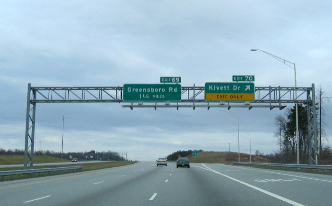 Photo of exit signage along the East Belt with new exit numbers based on I-74 
mileage, Dec. 2008