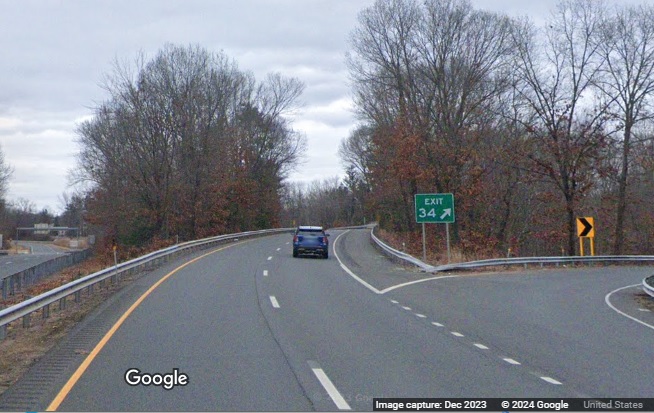 Image of gore sign for the Hubbard Street exit with new milepost based exit number uncovered
      on CT 17 North in Glastonbury, Google Maps Street View, December 2023