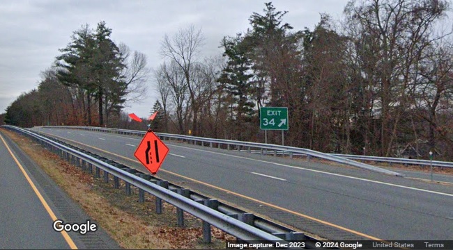 Image of new gore sign with new milepost based exit number for Hubbard Street exit not covered over
      on CT 17 South in Glastonbury, Google Maps Street View, December 2023
