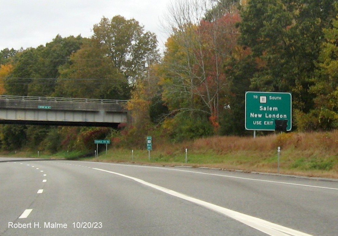 Image of new ground mounted auxiliary sign for CT 354/Parum Road exit on CT 2 West in Colchester with covered 
      over future exit number, October 2023