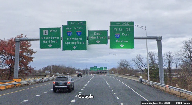 Image of new 4 overhead signs on CT 2 West at I-84 exits in East Hartford, Google Maps Street View, December 2023