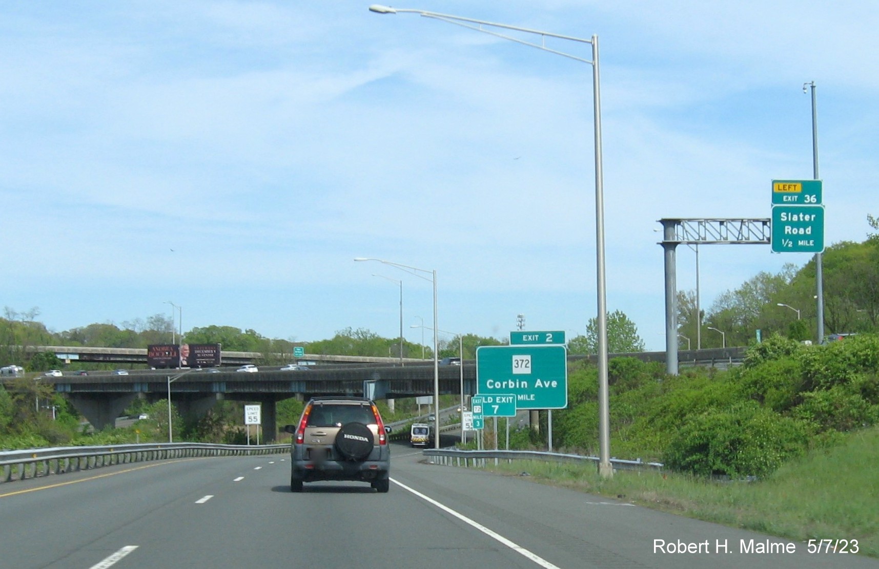 Image of ground mounted 1 Mile advance sign for CT 372 exit with new milepost based exit number and separate Old Exit 7 sign on CT 72 East in Bristol, May 2023