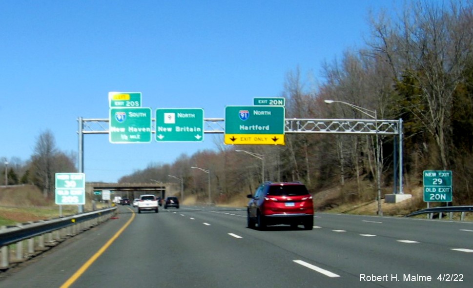Image of recently placed New and Old Exit number ground mounted signs put up for I-91 exit on CT 9 North in Middletown, April 2022