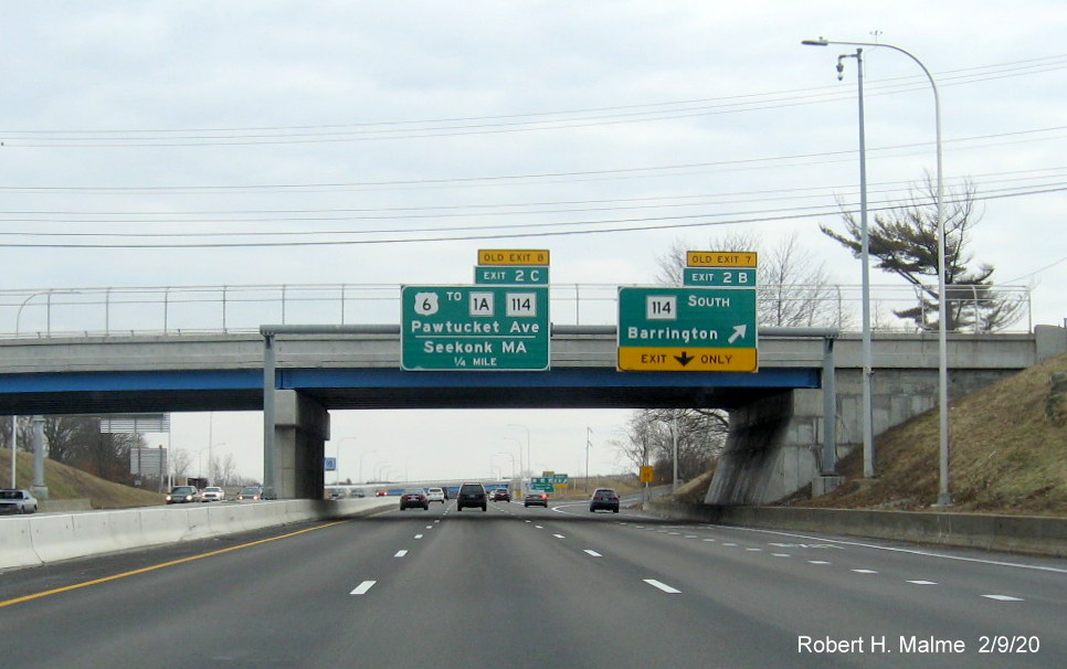 Image of overhead signs for RI 114 and US 6 exits with new milepost based exit numbers and yellow old exit tabs on I-195 East in East Providence