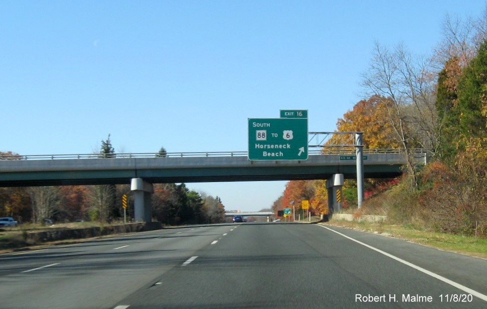 Image of overhead ramp sign at MA 88 South exit with new milepost based exit number and newly renumbered gore sign with yellow old exit number tab below, on I-195 West in Westport
