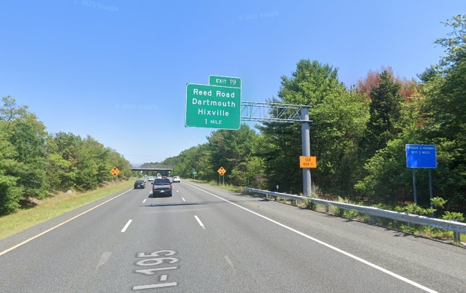 Google Maps Street View image of 1 mile advance overhead sign for Reed Road exit with new milepost based exit number and yellow Old Exit 11 advisory sign on support on I-195 East in Dartmouth, July 2021