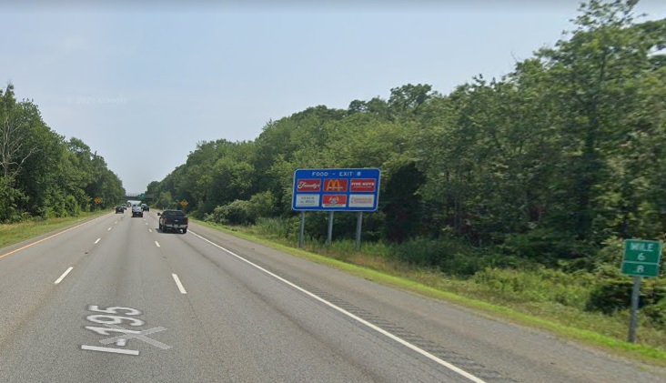 Google Maps Street View image of blue Food Services sign for US 6 exit with new milepost based exit number on I-195 East in Swansea, July 2021
