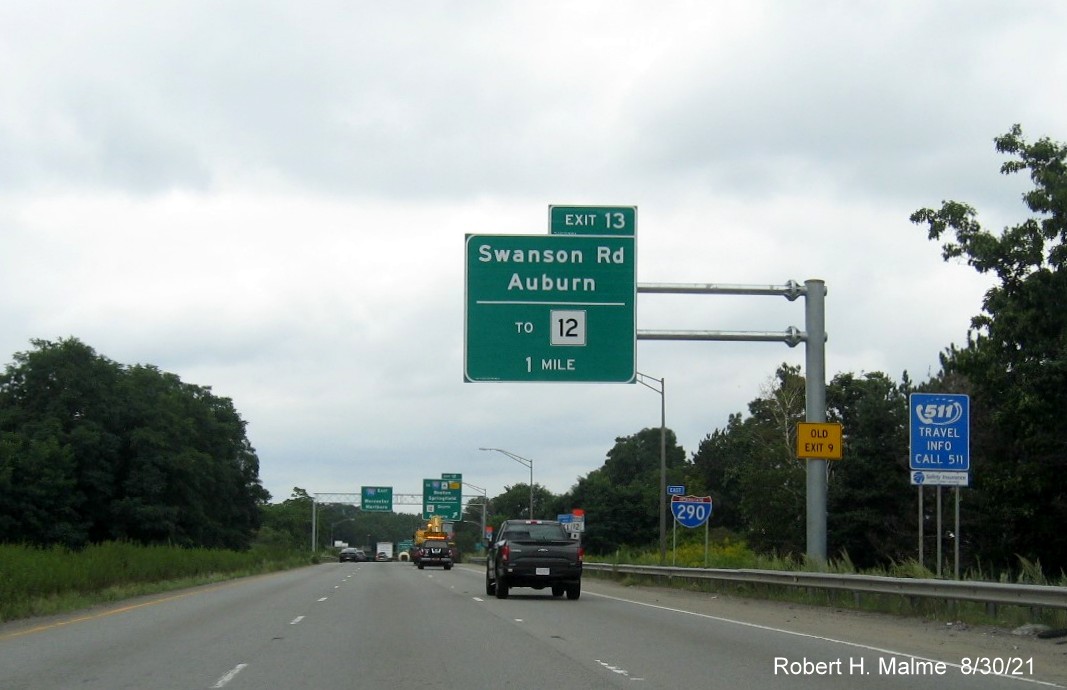 Image of 1 mile advance overhead sign for Swanson Road exit with new I-395 milepost exit number and yellow Old Exit 8 advisory sign on support on I-290 East in Auburn, August 2021