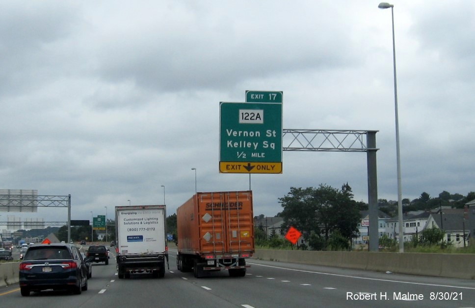 Image of recently placed 1/2 mile advance overhead sign for MA 122A / Kelley Square exit with new I-395 milepost based exit number on I-290 East in Worcester, August 2021