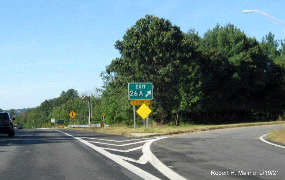 Image of gore sign for MA 140 South exit with new milepost based exit number and yellow Old Exit 26A sign attached below on I-290 West in Shrewsbury, September 2021