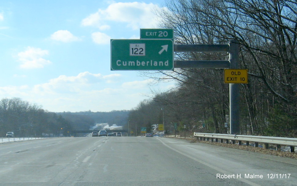 Image of overhead sign for RI 122 exit ramp on I-295 South in Cumberland with new exit number