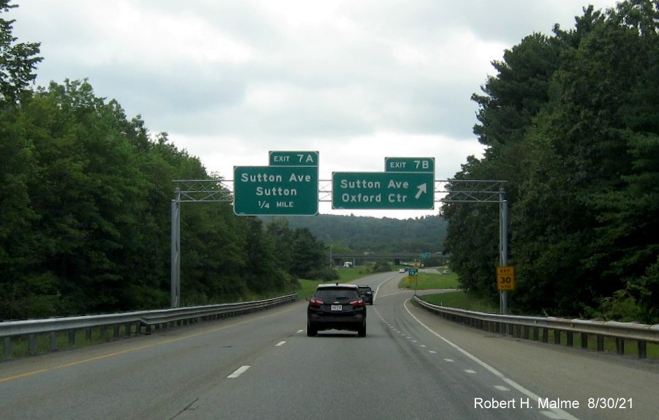 Image of overhead advance signage for Sutton Avenue exits with new milepost based exit number I-395 South in Oxford, August 2021 
