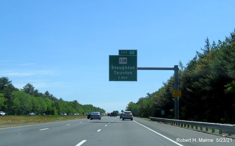 Image of 1 mile advance overhead sign for MA 138 exit with new milepost based exit number and yellow Old Exit 8 advisory sign on support on I-495 South in Taunton, May 2021